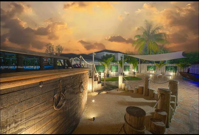 a view of a patio with swimming pool table and chairs