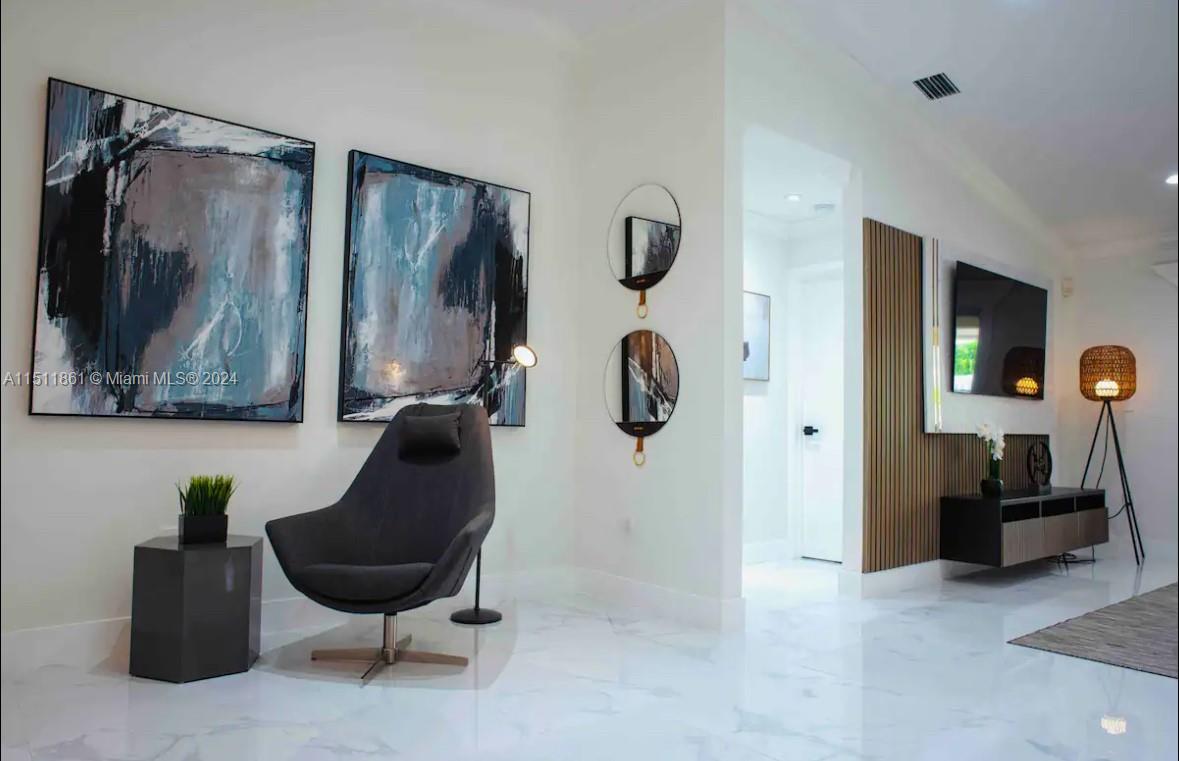 14236 Southwest 164th Terrace Miami, FL 33177 - Photo 10 of 29 a living room with furniture and a flat screen tv