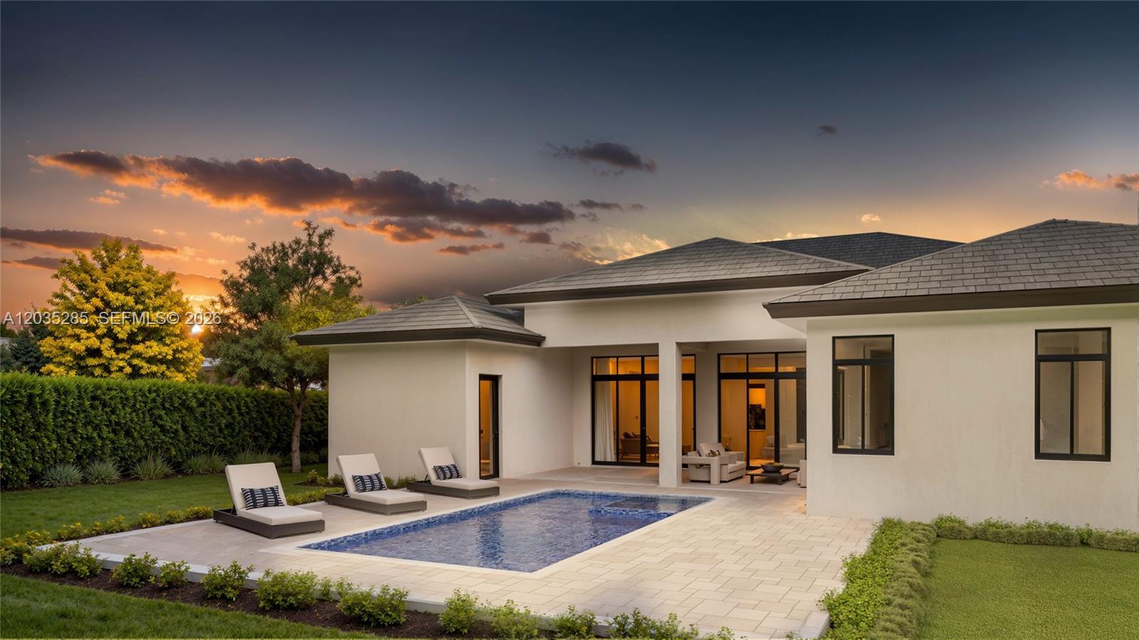 29609 Southwest 194th Court Homestead, FL 33030 - Photo 2 of 7 a front view of a house with garden