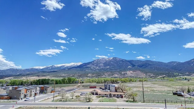 a view of a street with a building in the background