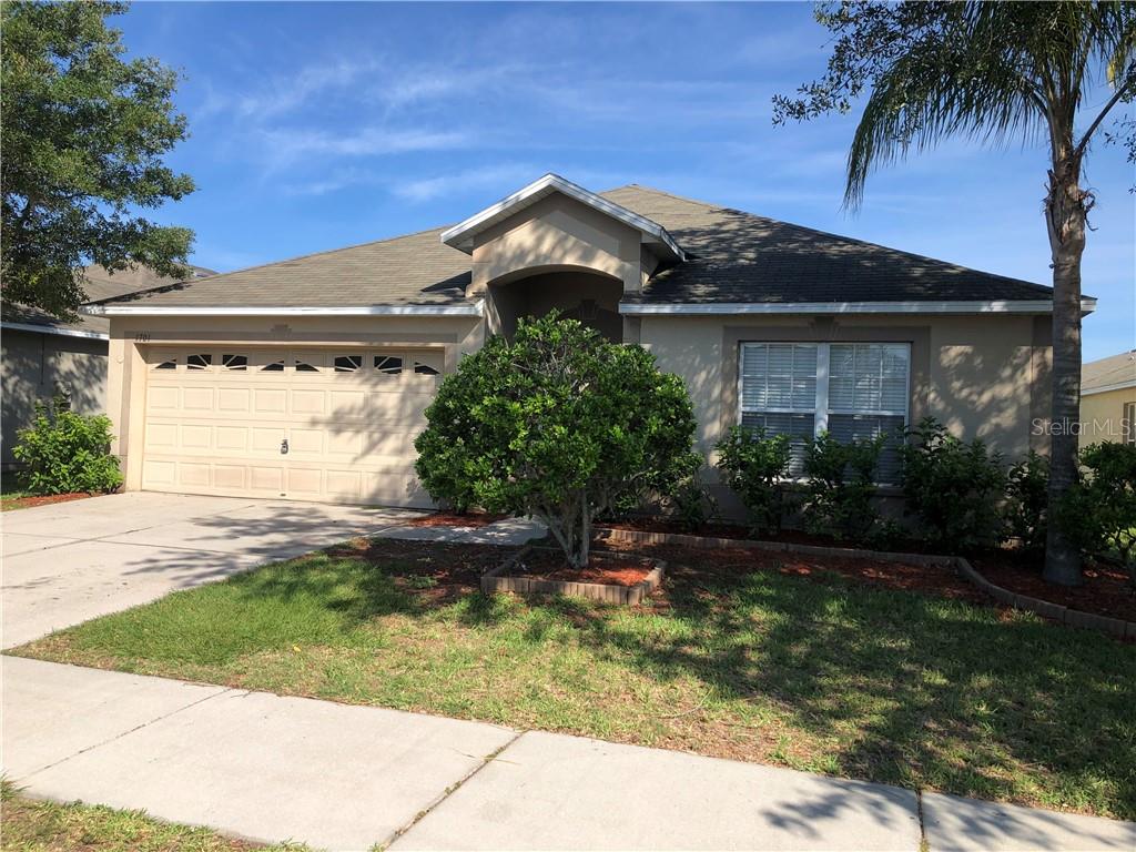 1701 Holton Road Lakeland, FL 33810 - Photo 1 of 1 a front view of a house with garden