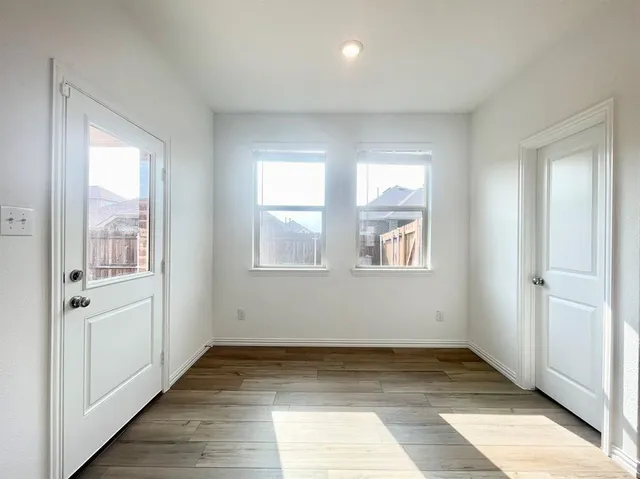 a view of an empty room and window