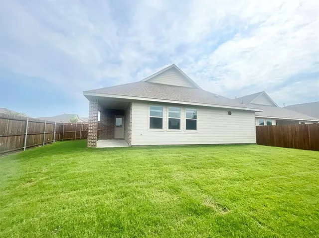 a backyard of a house with lots of green space