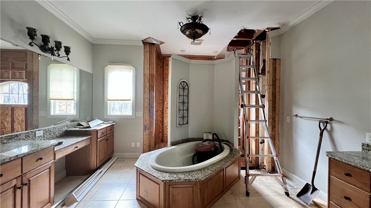 6362 Autumn Ridge Court Decatur, IL 62521 - Photo 15 of 40 a bathroom with a sink a toilet and a mirror