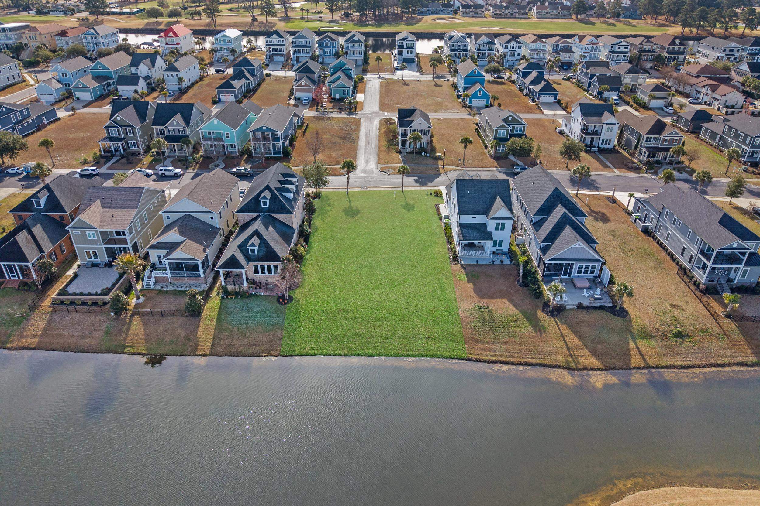 861 Crystal Water Way Myrtle Beach, SC 29579 - Photo 4 of 20 Aerial view of residential area featuring a large body of water