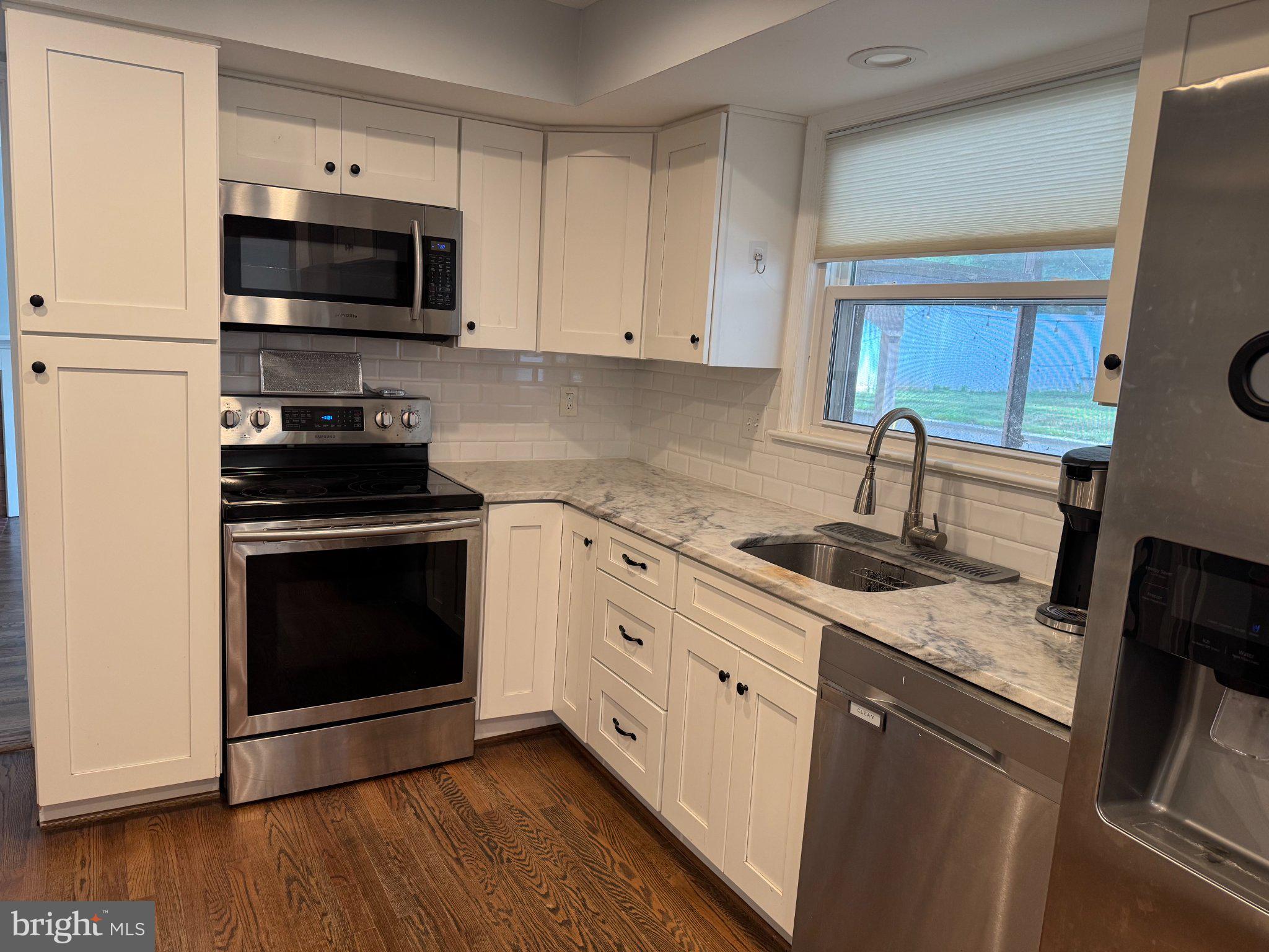 6603 Huntsman Boulevard Springfield, VA 22152 - Photo 8 of 64 Modern kitchen with sleek finishes.