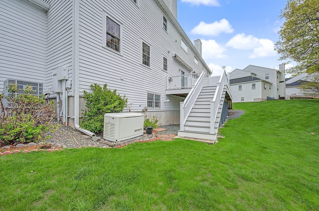 3 Oak View Terrace, Unit 3 Franklin, MA 02038 - Photo 32 of 38 a view of a house with a yard and sitting area