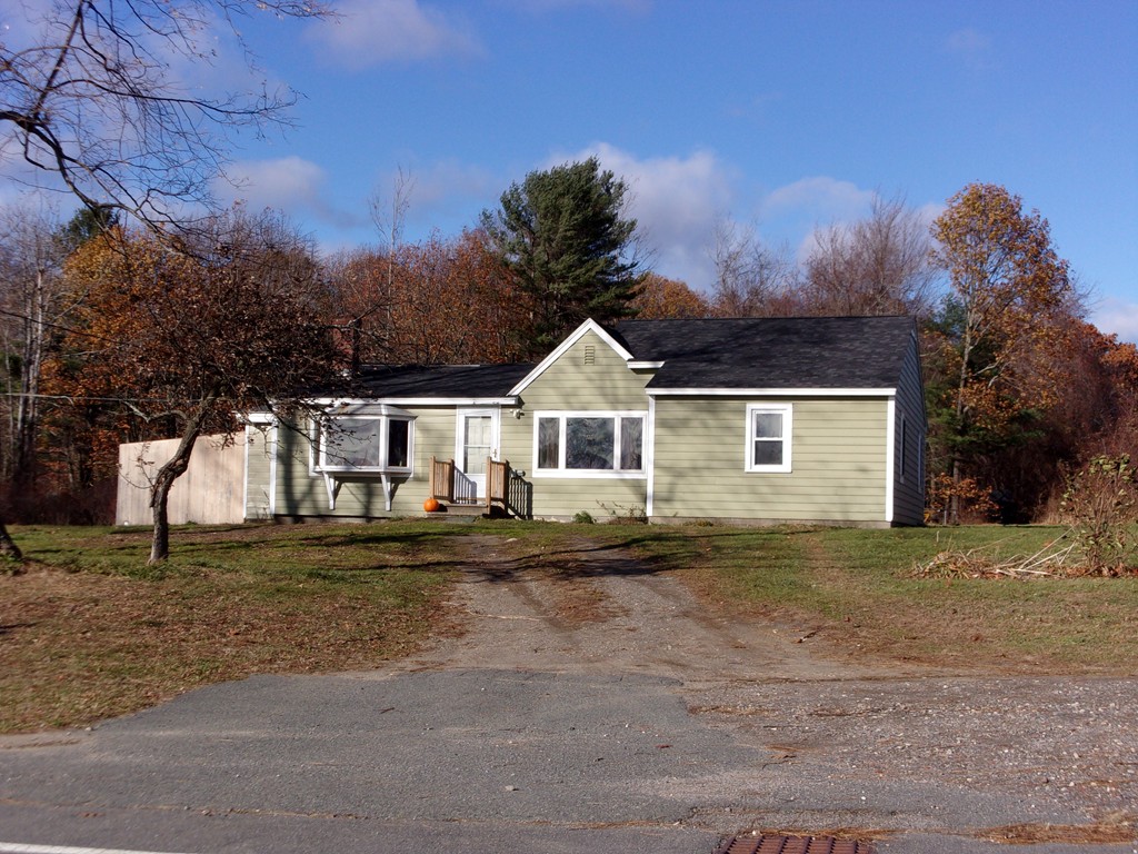145 Main Road Westhampton, MA 01027 - Photo 1 of 30 a front view of a house with a yard and garage