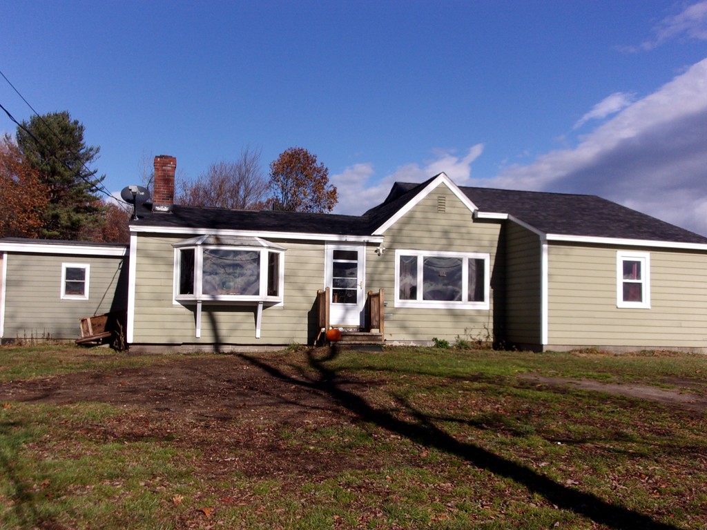 145 Main Road Westhampton, MA 01027 - Photo 2 of 30 a front view of a house with a yard