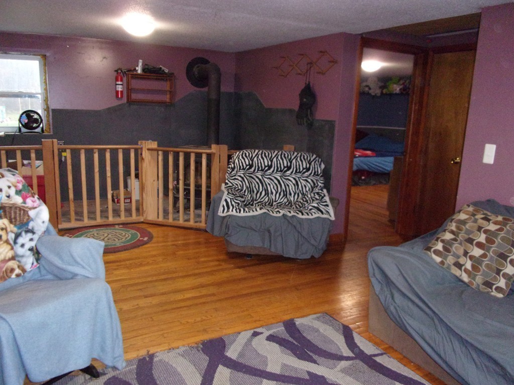145 Main Road Westhampton, MA 01027 - Photo 21 of 30 a view of a livingroom with furniture and stairs