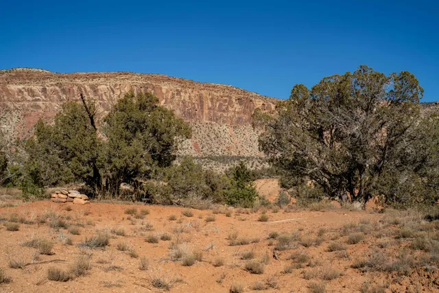 a view of a snow covered with snow in the background