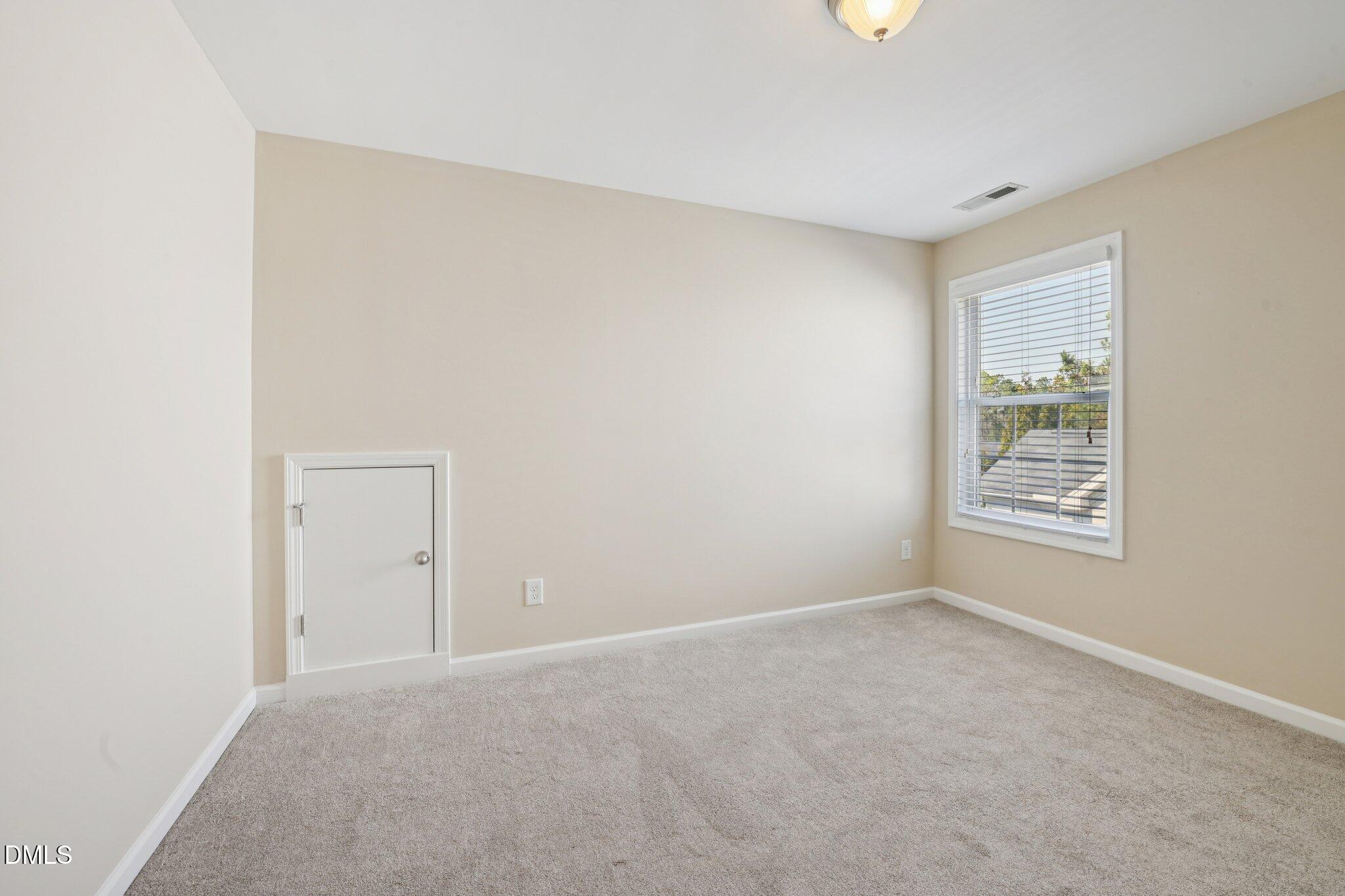 11 Hidden Ridge Court Durham, NC 27707 - Photo 23 of 30 a view of an empty room with a window