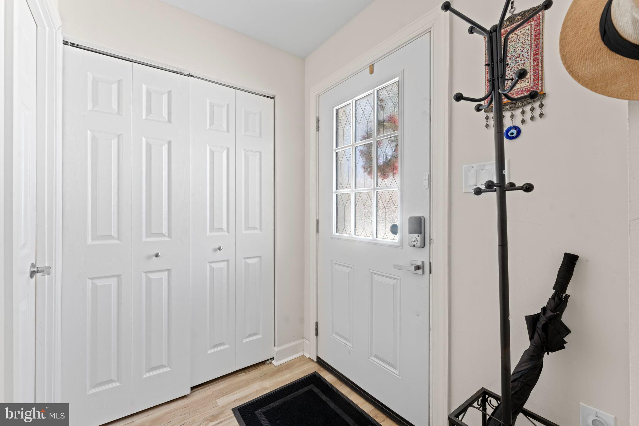 6406 Gildar Street Alexandria, VA 22310 - Photo 24 of 32 Front door entrance, coat closet and half bath.