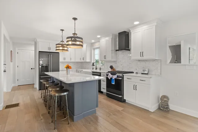 a kitchen with a sink stove and cabinets
