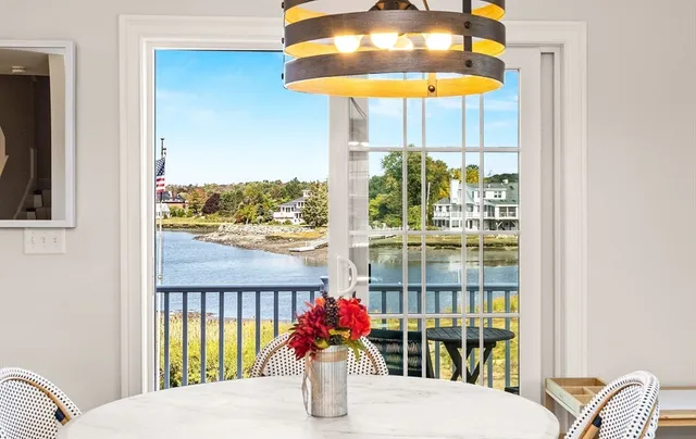 a bedroom with a bed and chandelier