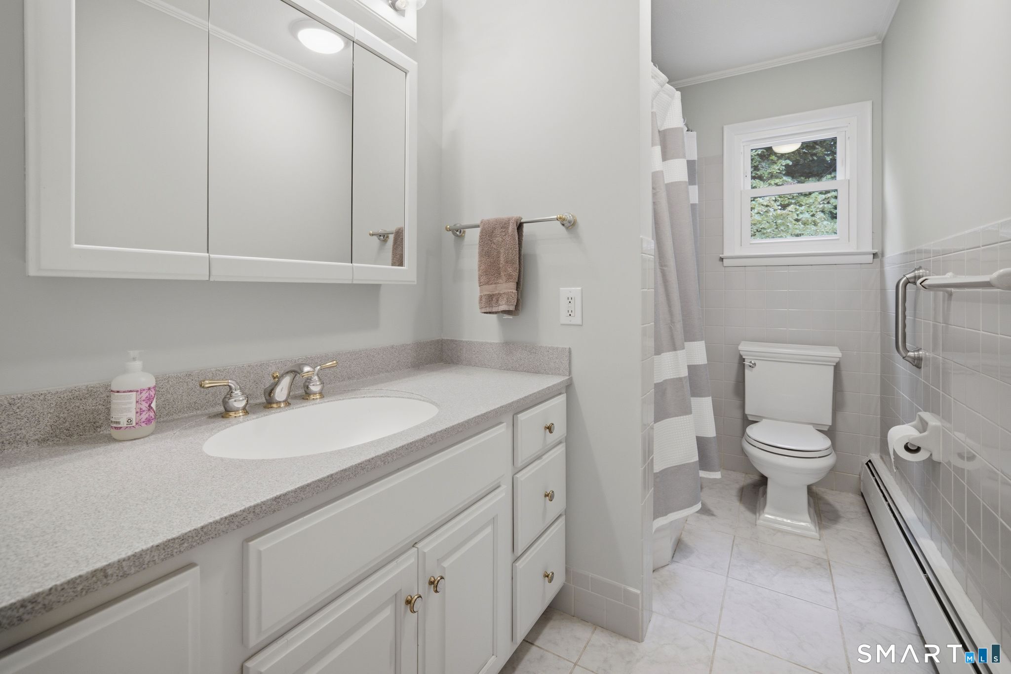 19 Sycamore Road Bloomfield, CT 06002 - Photo 30 of 38 This beautifully remodeled bathroom is shared by the two additional bedroom.