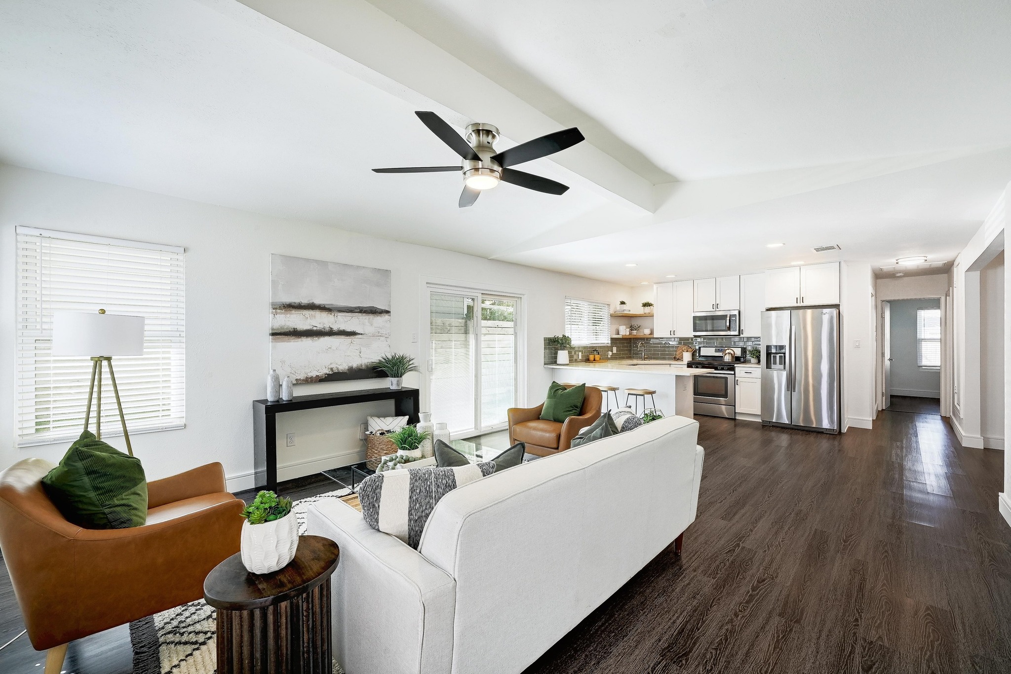 6222 Boxcar Run Austin, TX 78745 - Photo 1 of 1 Living room featuring dark wood-style flooring, healthy amount of natural light, ceiling fan, and recessed lighting