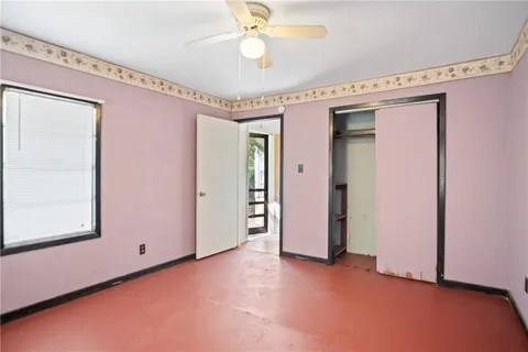 228 Southwest 8th Street Premont, TX 78375 - Photo 15 of 19 a view of a hallway with a window and chandelier fan