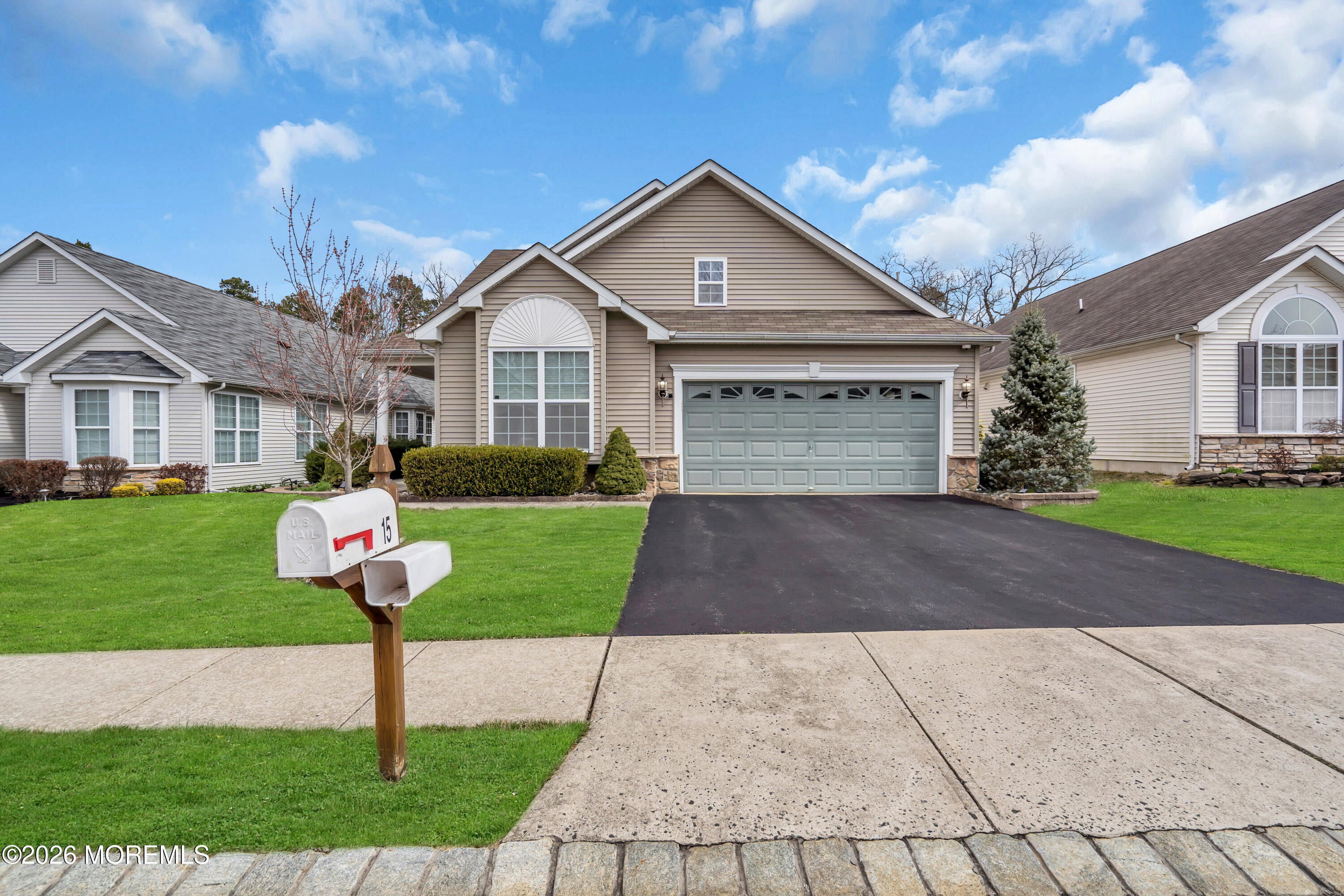 15 Enclave Boulevard Lakewood, NJ 08701 - Photo 1 of 81 a front view of a house with a yard and trees