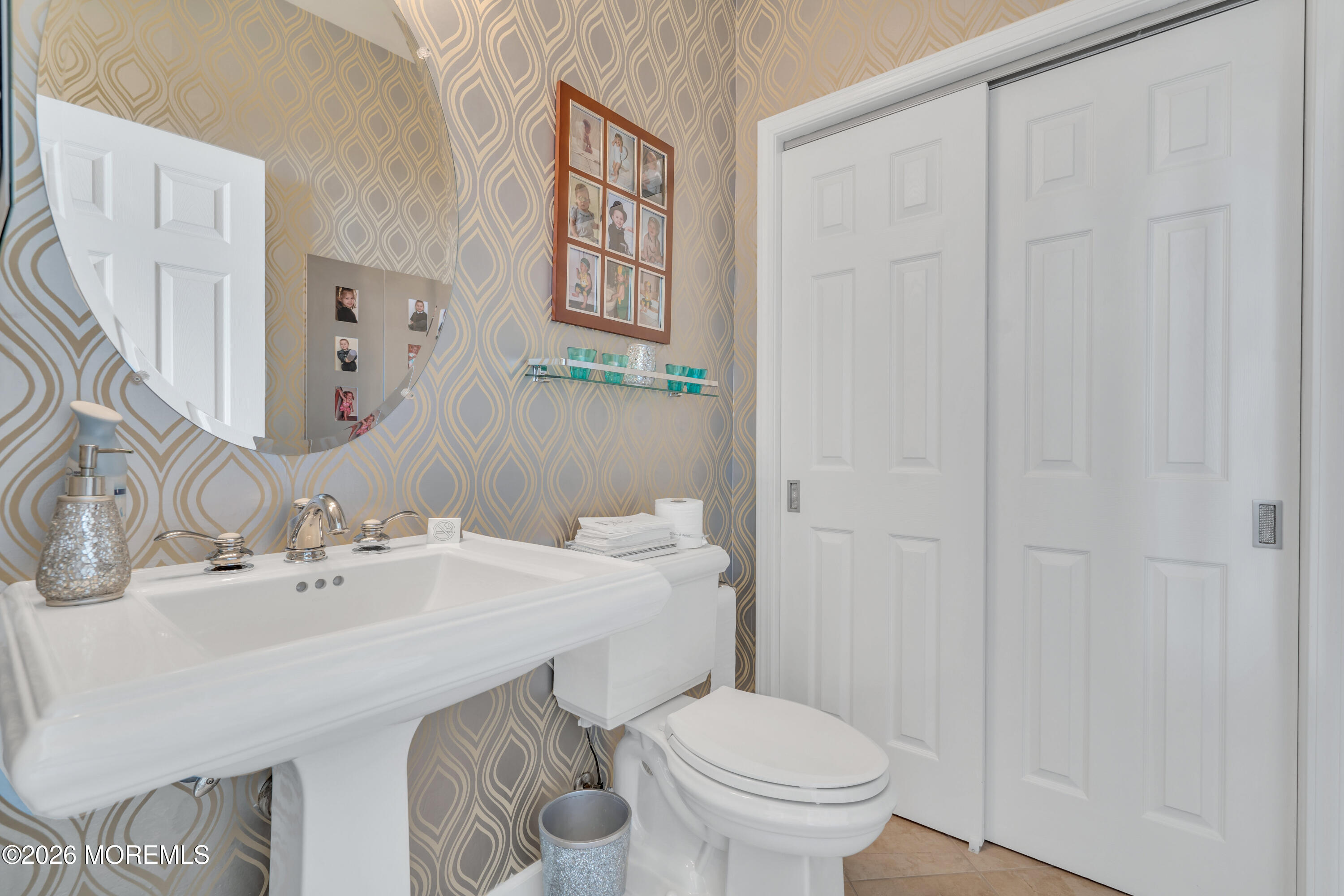 15 Enclave Boulevard Lakewood, NJ 08701 - Photo 21 of 81 a bathroom with a sink a toilet and a mirror