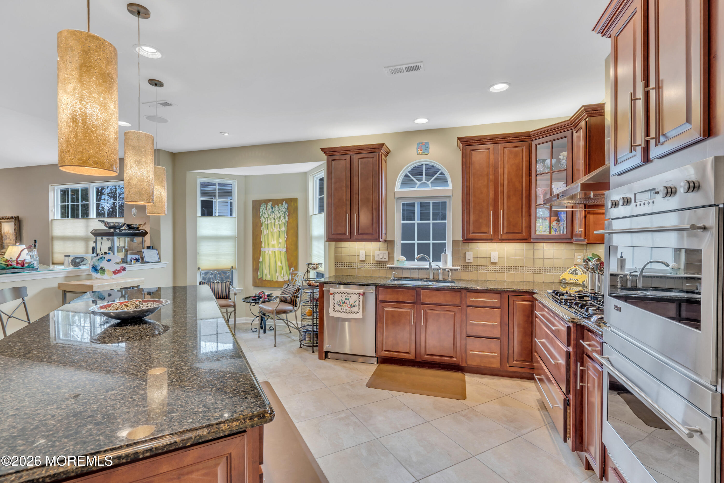 15 Enclave Boulevard Lakewood, NJ 08701 - Photo 29 of 81 a large kitchen with granite countertop a large counter top space and stainless steel appliances