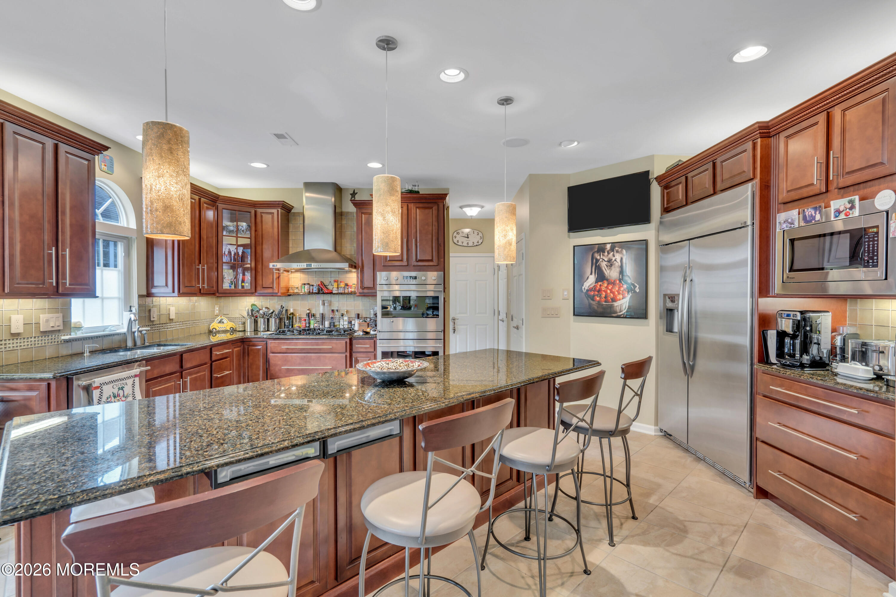 15 Enclave Boulevard Lakewood, NJ 08701 - Photo 34 of 81 a kitchen with stainless steel appliances granite countertop a sink and a refrigerator