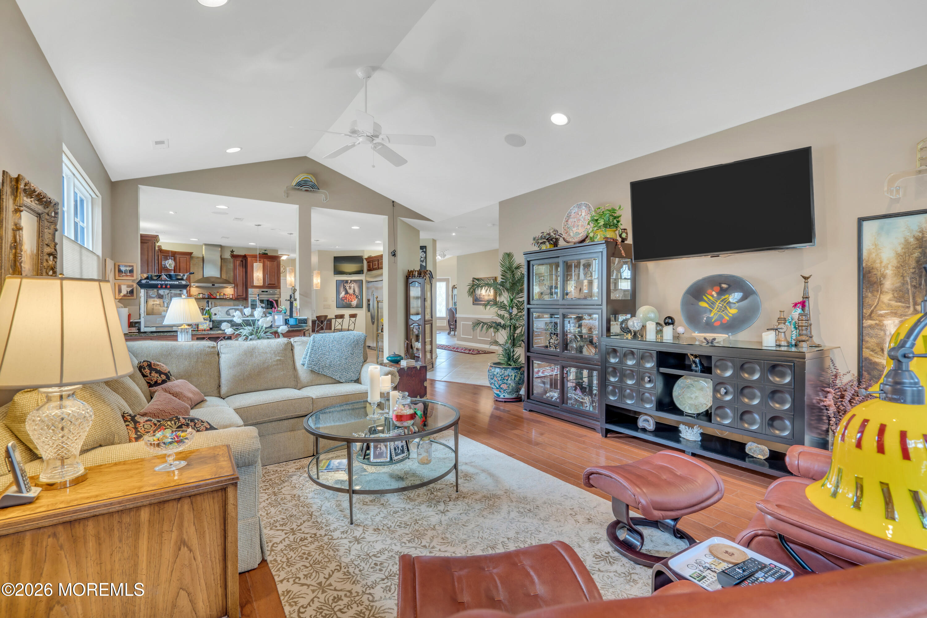 15 Enclave Boulevard Lakewood, NJ 08701 - Photo 41 of 81 a living room with furniture and a flat screen tv