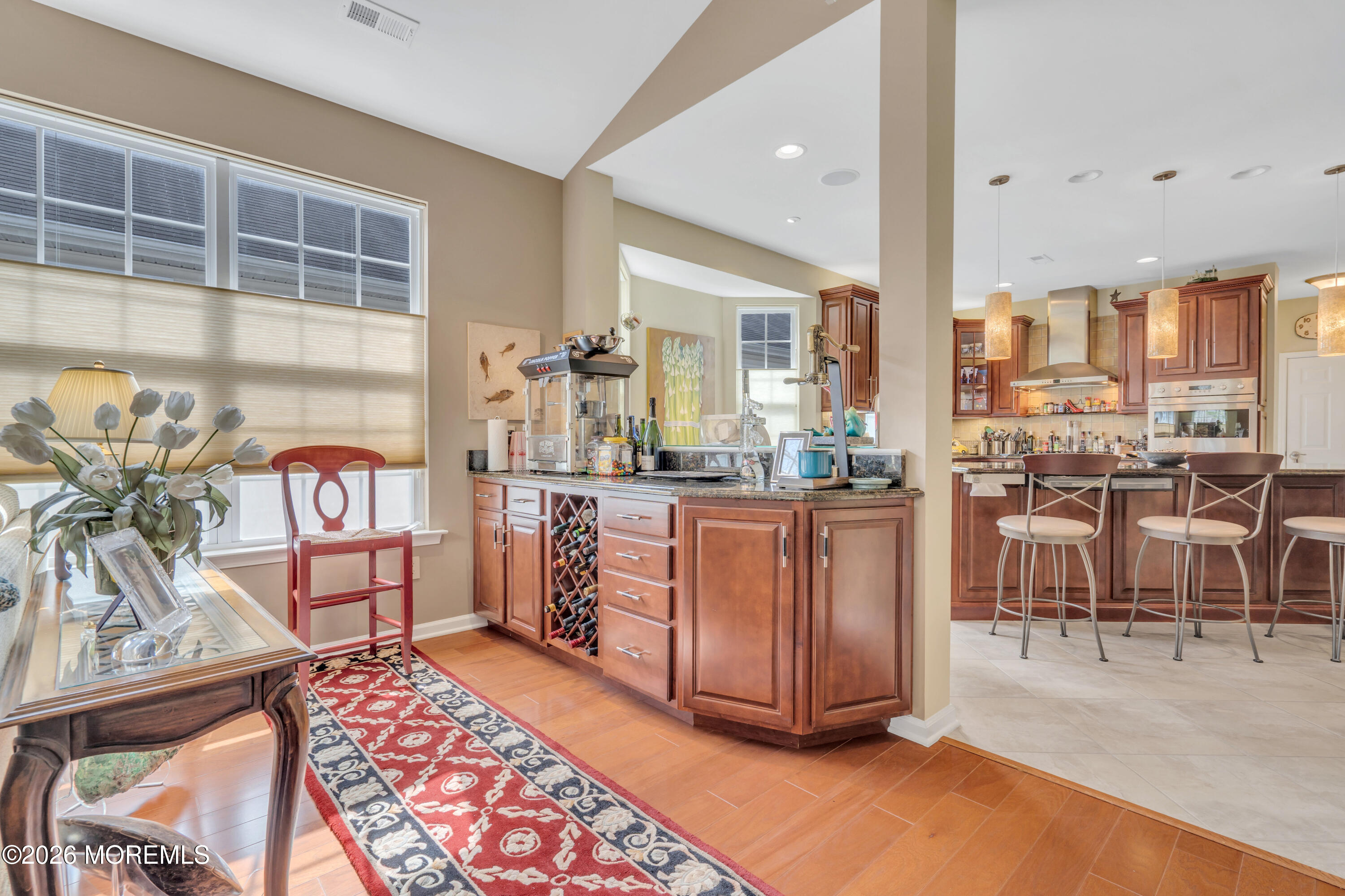 15 Enclave Boulevard Lakewood, NJ 08701 - Photo 60 of 81 a room with stainless steel appliances kitchen island granite countertop furniture and a view of living room