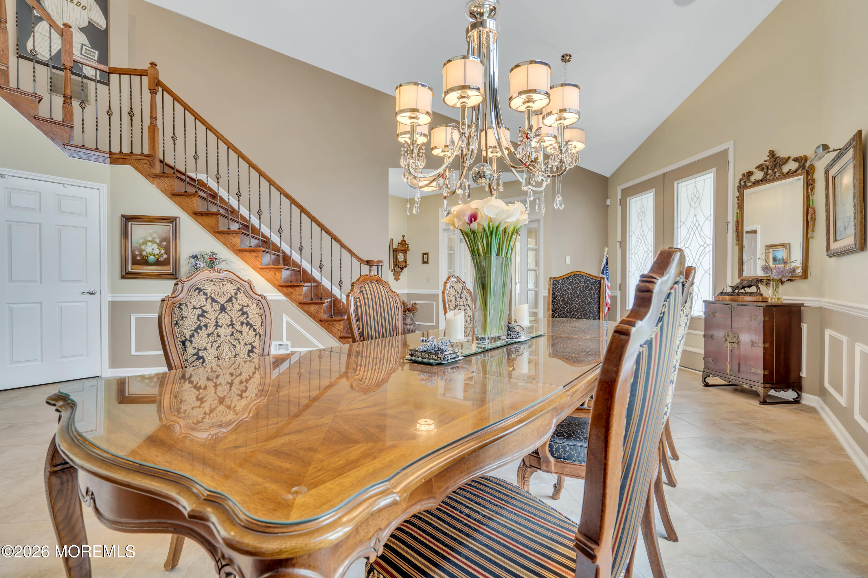 15 Enclave Boulevard Lakewood, NJ 08701 - Photo 9 of 81 a dining room with furniture a chandelier and wooden floor