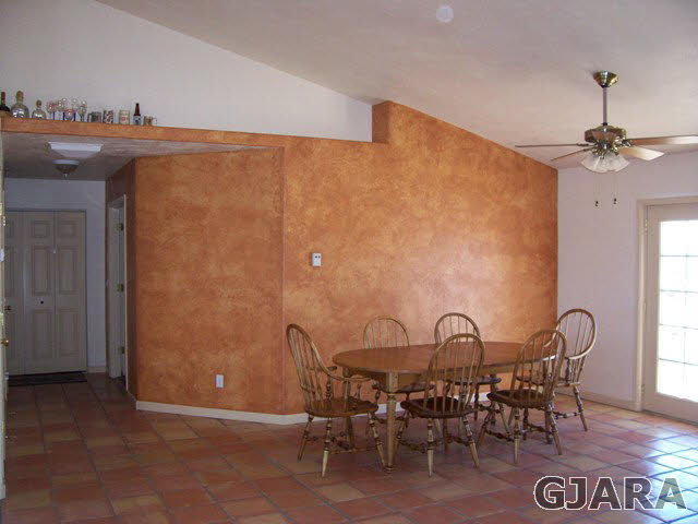 20258 Fox Ridge Drive Austin, CO 81410 - Photo 3 of 6 a view of a dining room with furniture and window