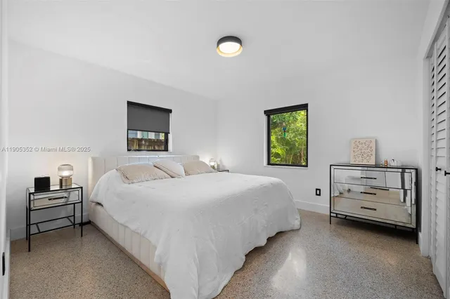 a bedroom with a bed and a closet