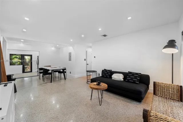 a living room with furniture and a couch