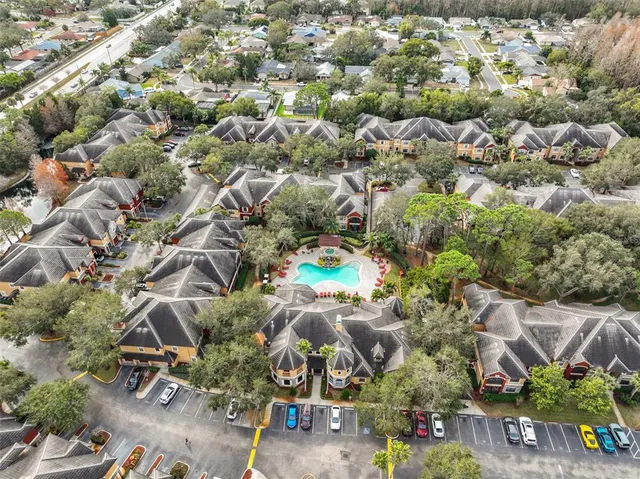 an aerial view of residential houses with outdoor space