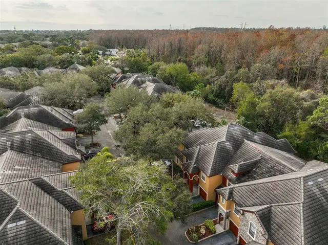 an aerial view of a house with outdoor space