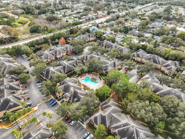 an aerial view of residential houses with outdoor space