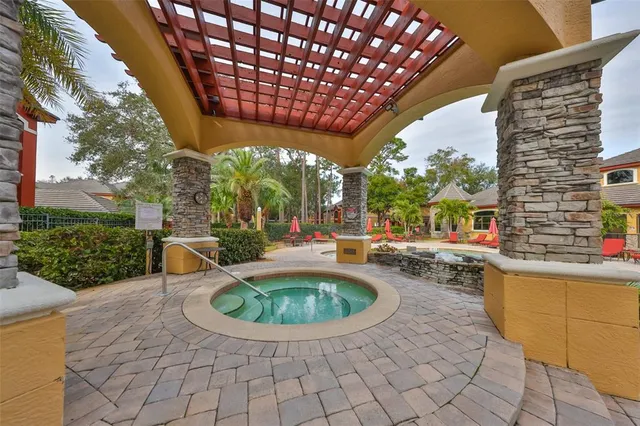 a view of a swimming pool with a patio