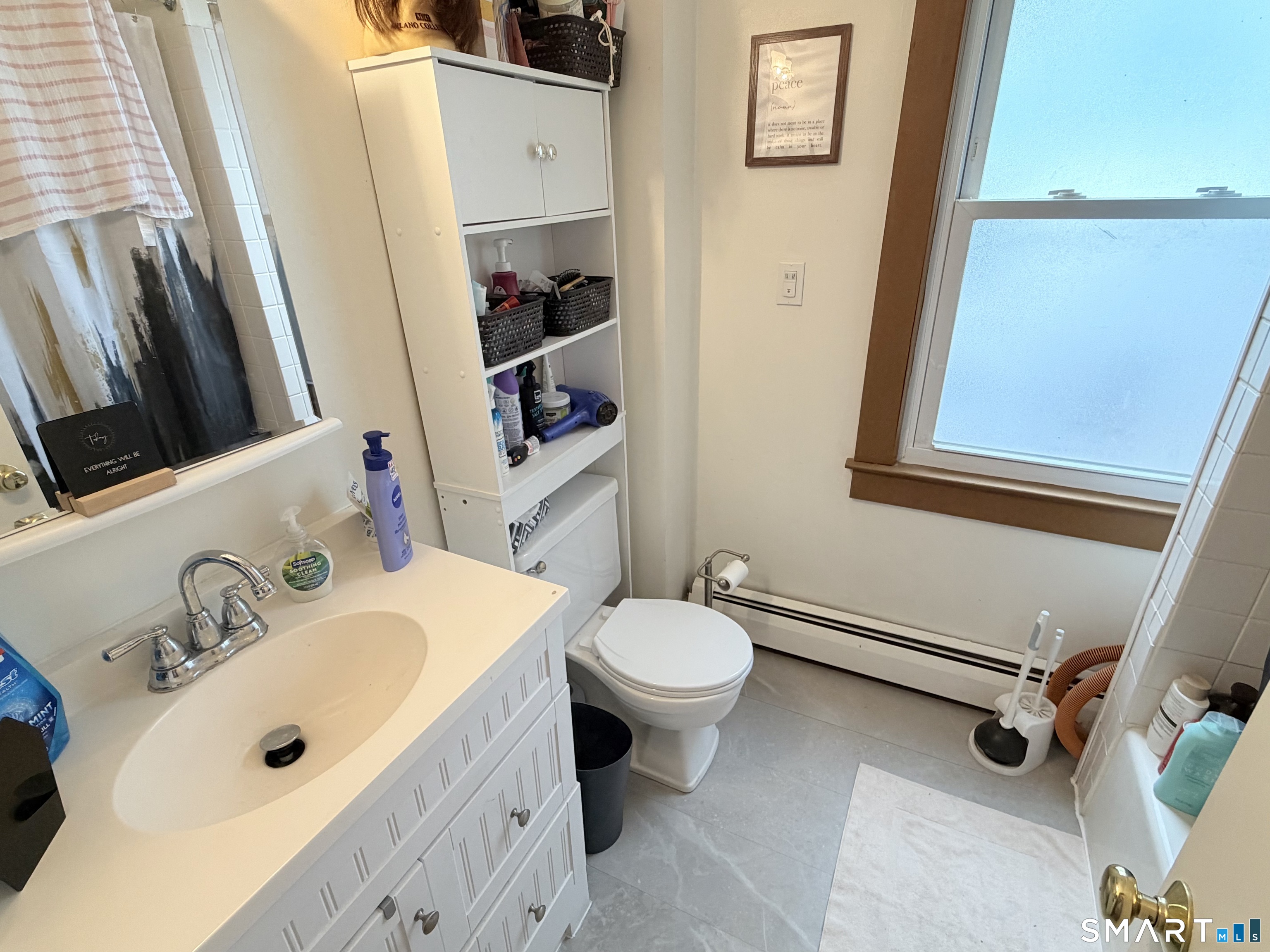 67 Pine Street Meriden, CT 06451 - Photo 10 of 34 a bathroom with a sink a toilet and a mirror