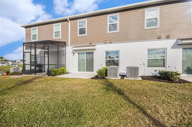 a view of a house with backyard and garden