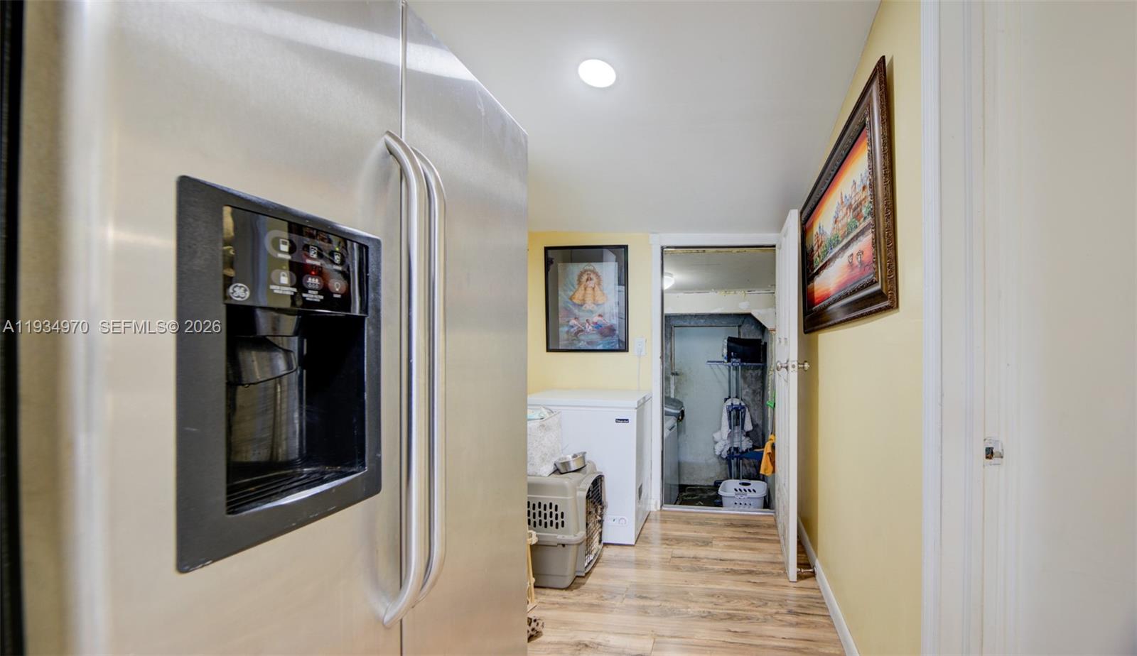 1911 Northwest 52nd Street Miami, FL 33142 - Photo 14 of 48 a view of a hallway view with wooden floor and living room