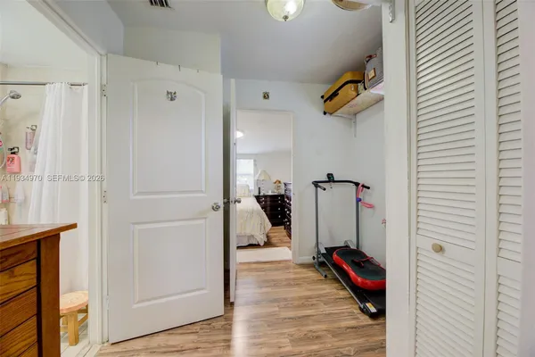 a bathroom with a sink toilet vanity and tub