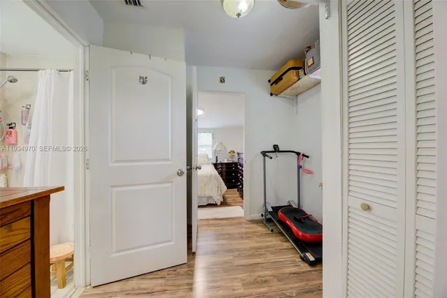 a bathroom with a sink toilet vanity and tub