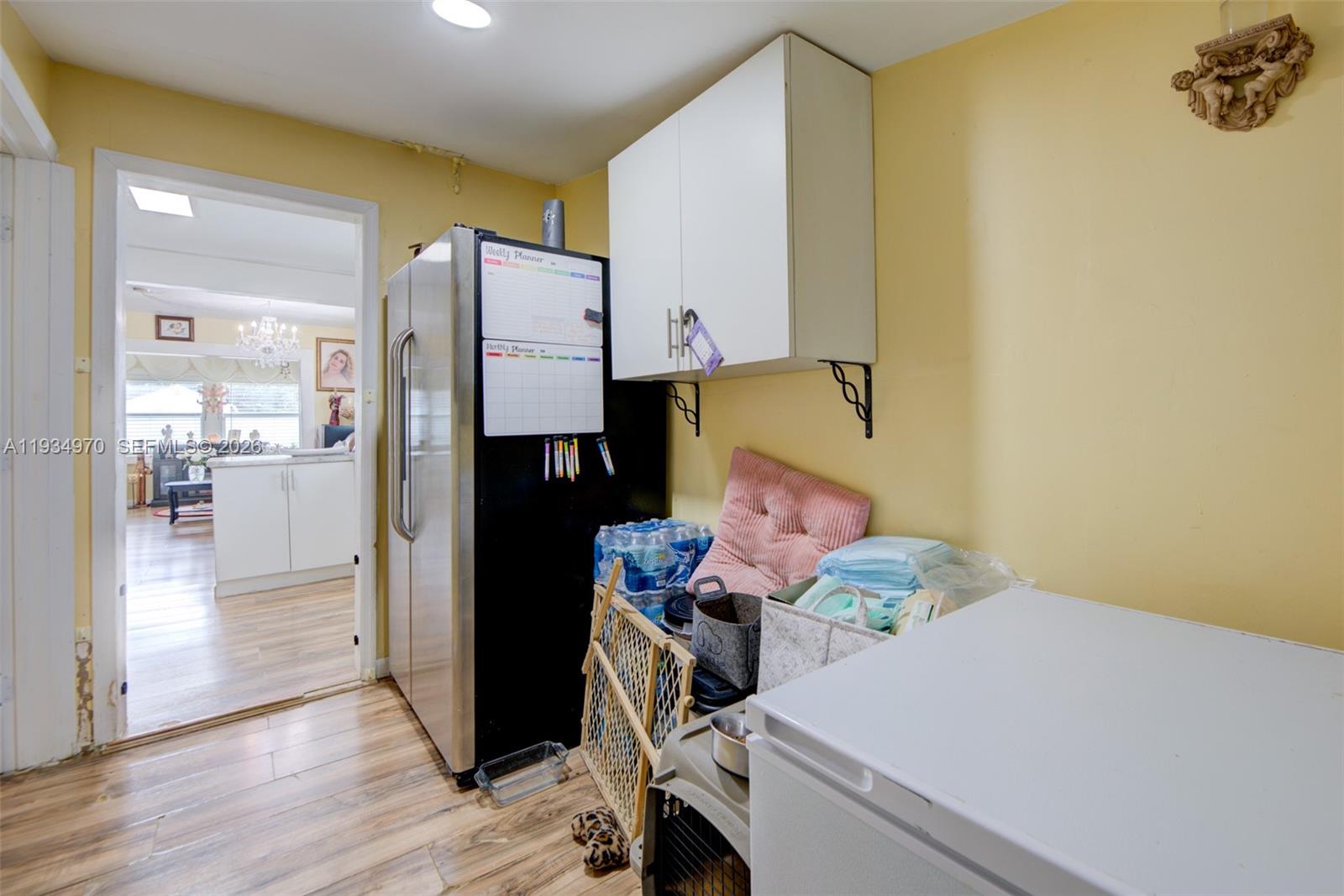 1911 Northwest 52nd Street Miami, FL 33142 - Photo 23 of 48 a room with storage and utility