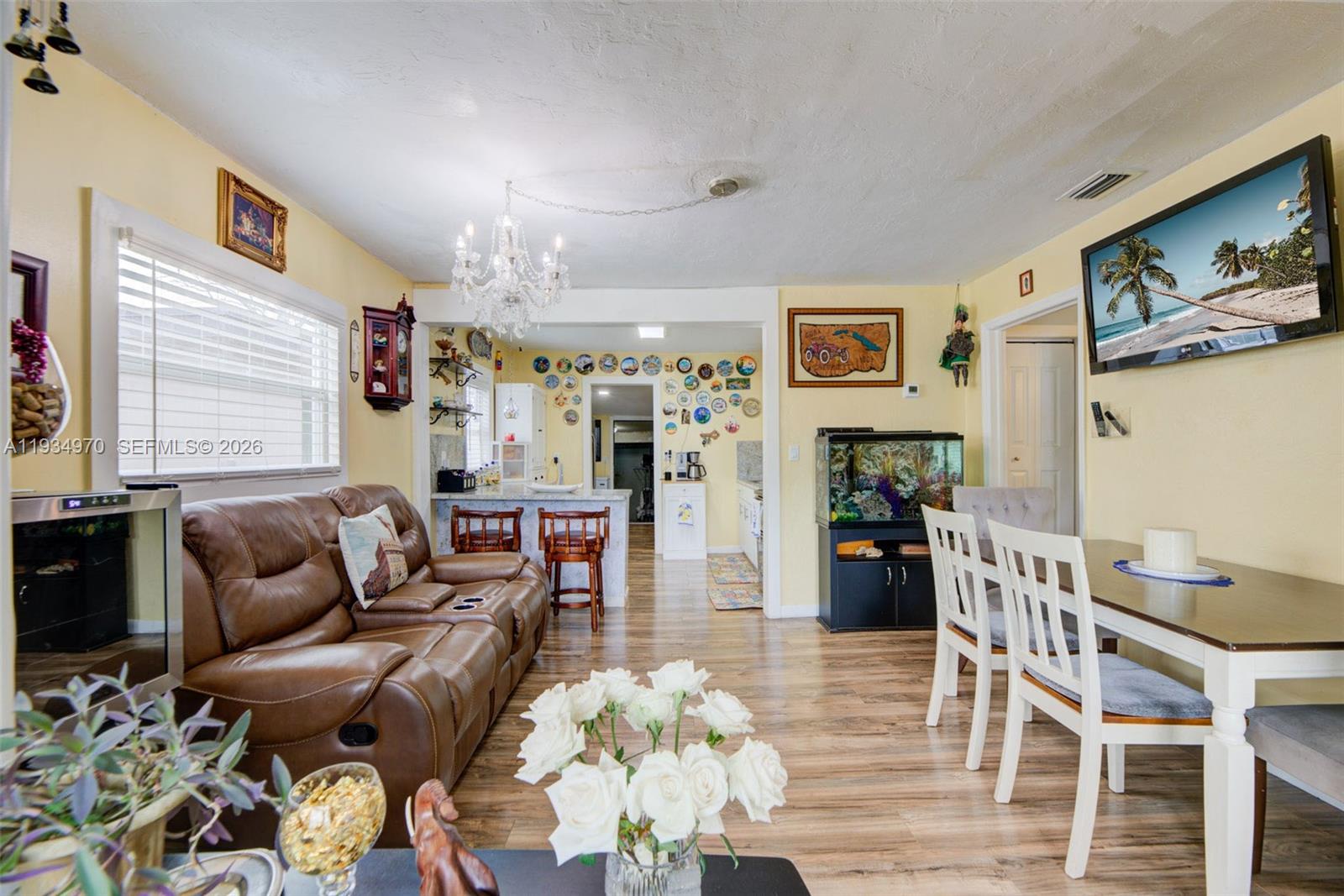 1911 Northwest 52nd Street Miami, FL 33142 - Photo 3 of 48 a living room with furniture fireplace and wooden floor