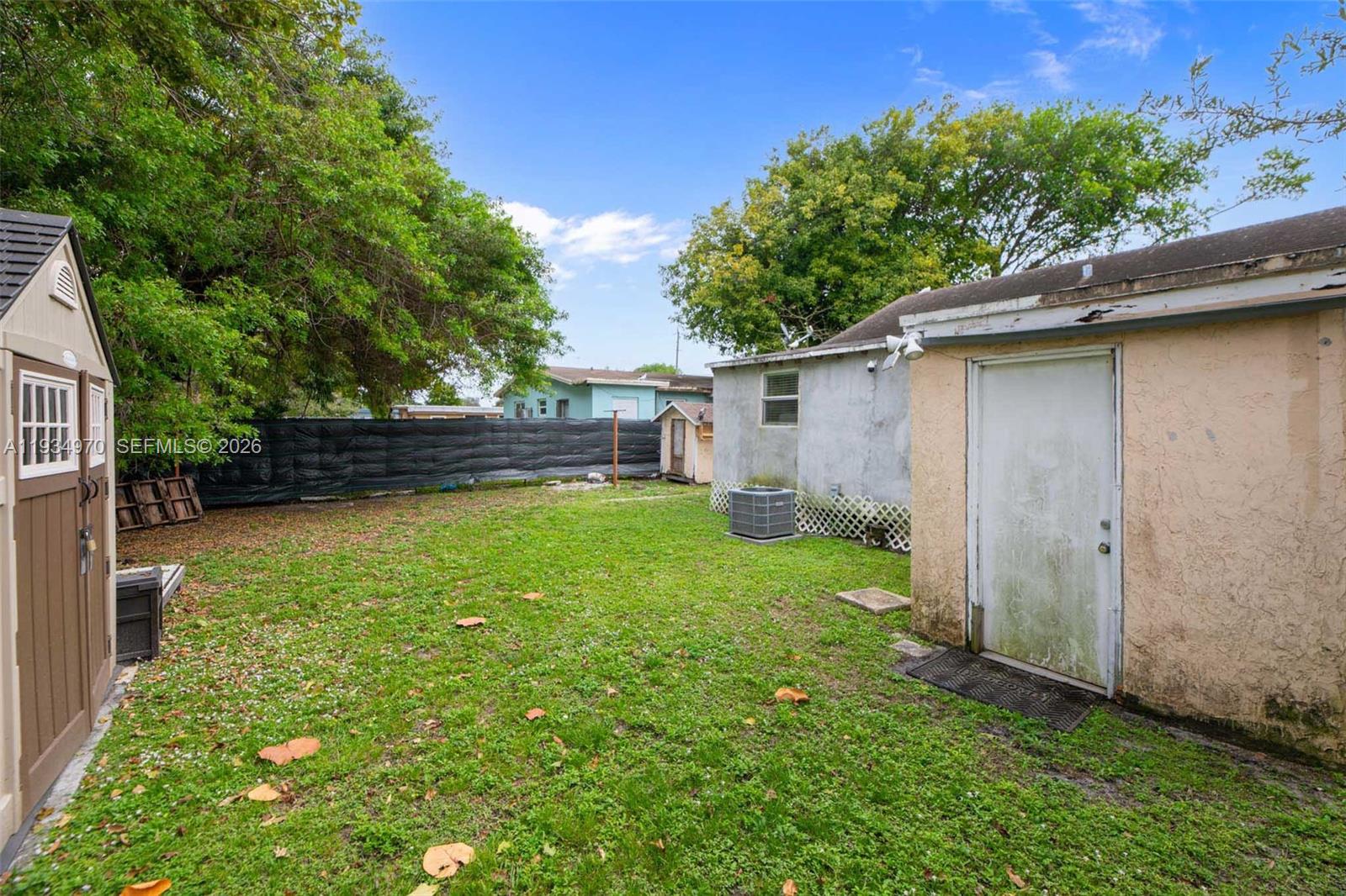 1911 Northwest 52nd Street Miami, FL 33142 - Photo 31 of 48 a view of a backyard with a garden