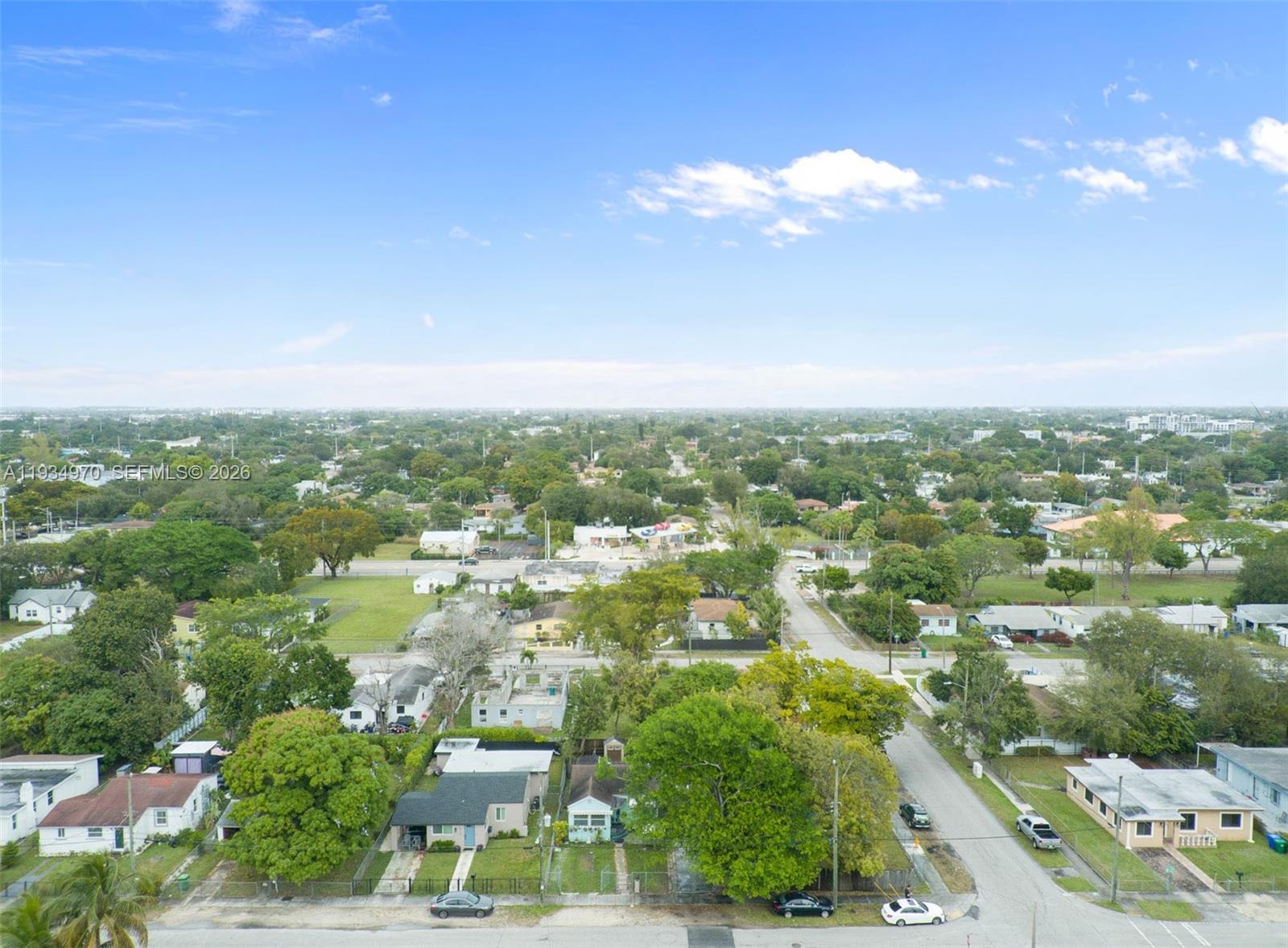 1911 Northwest 52nd Street Miami, FL 33142 - Photo 39 of 48 an aerial view of residential houses with city view