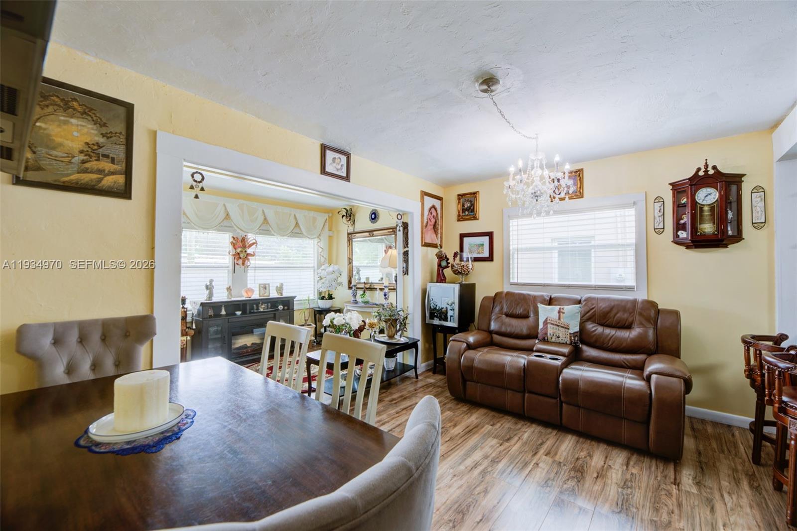 1911 Northwest 52nd Street Miami, FL 33142 - Photo 5 of 48 a living room with furniture and wooden floor