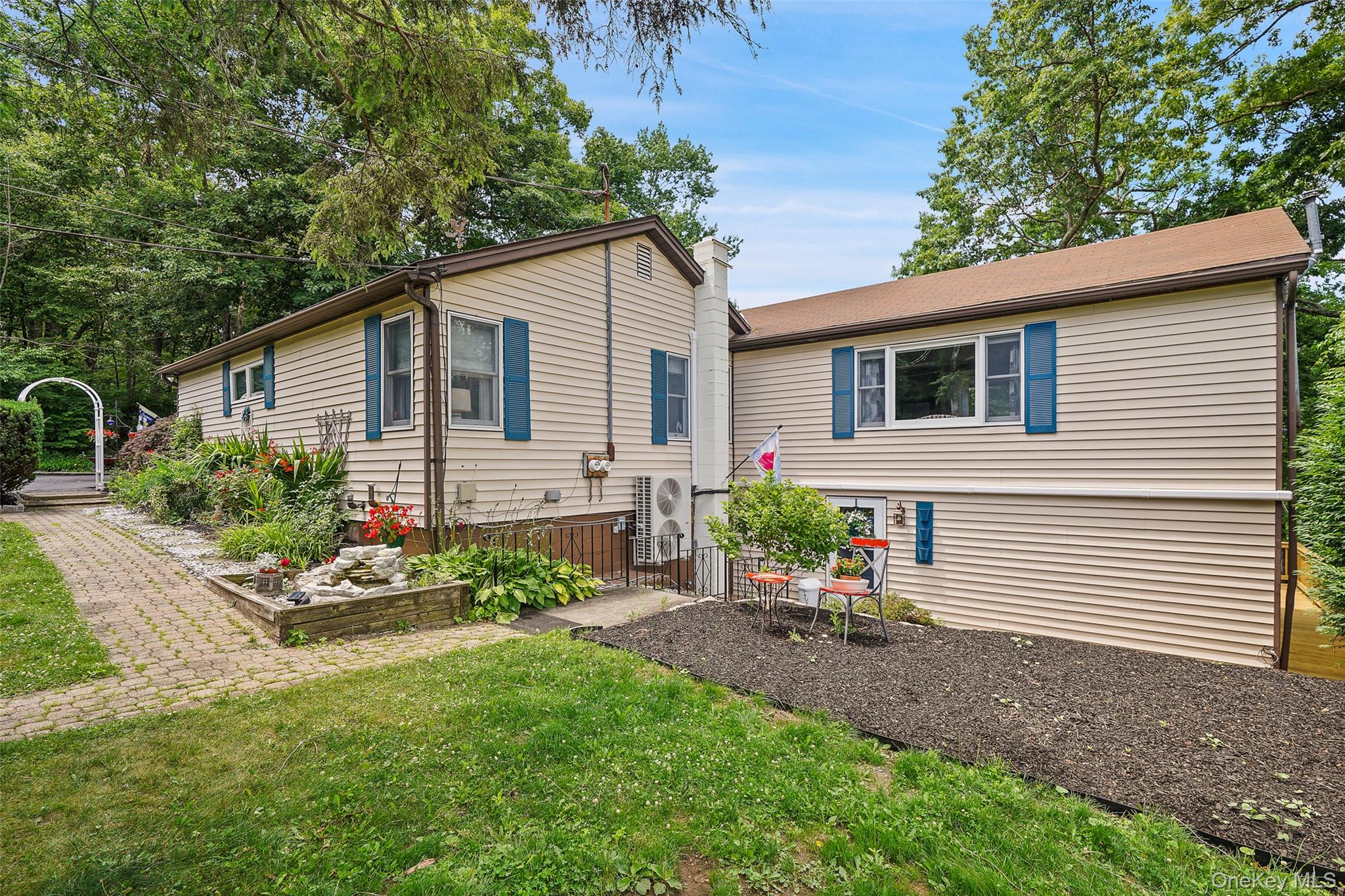 18 Sylvan Road Lake Peekskill, NY 10537 - Photo 5 of 50 Beautiful gardens with views of the entrance of stairs down to the apartment