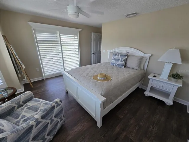 a view of a livingroom with furniture and a floor to ceiling window