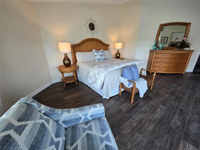 a view of a chairs and table on the wooden floor