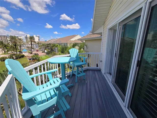 a view of a patio with wooden floor